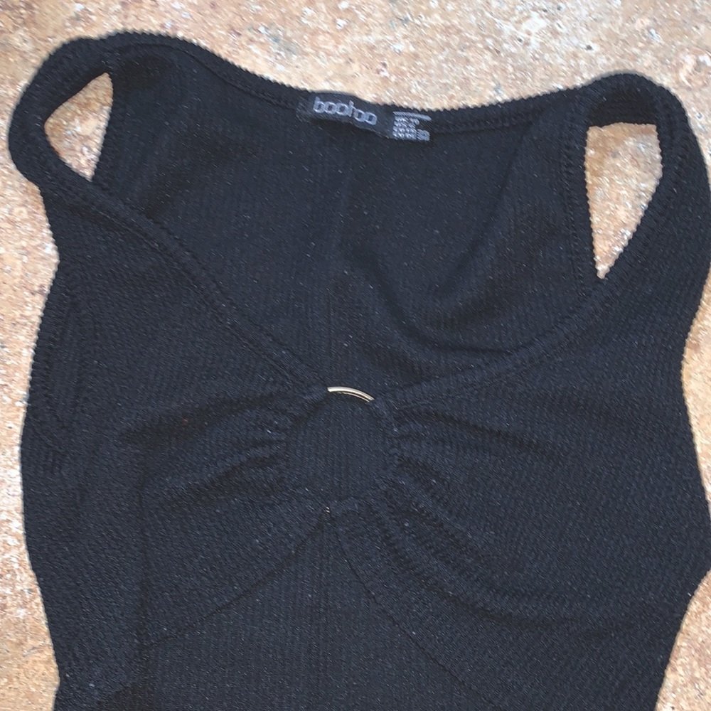 It is a crop top very cropped it is very fuzzy